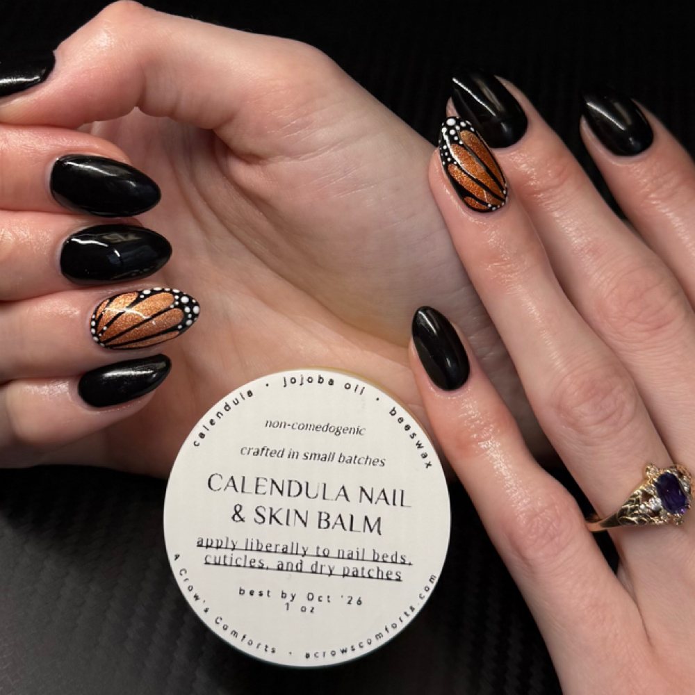 Calendula nail and skin balm from A Crow's Comforts, next to a set by Gracie