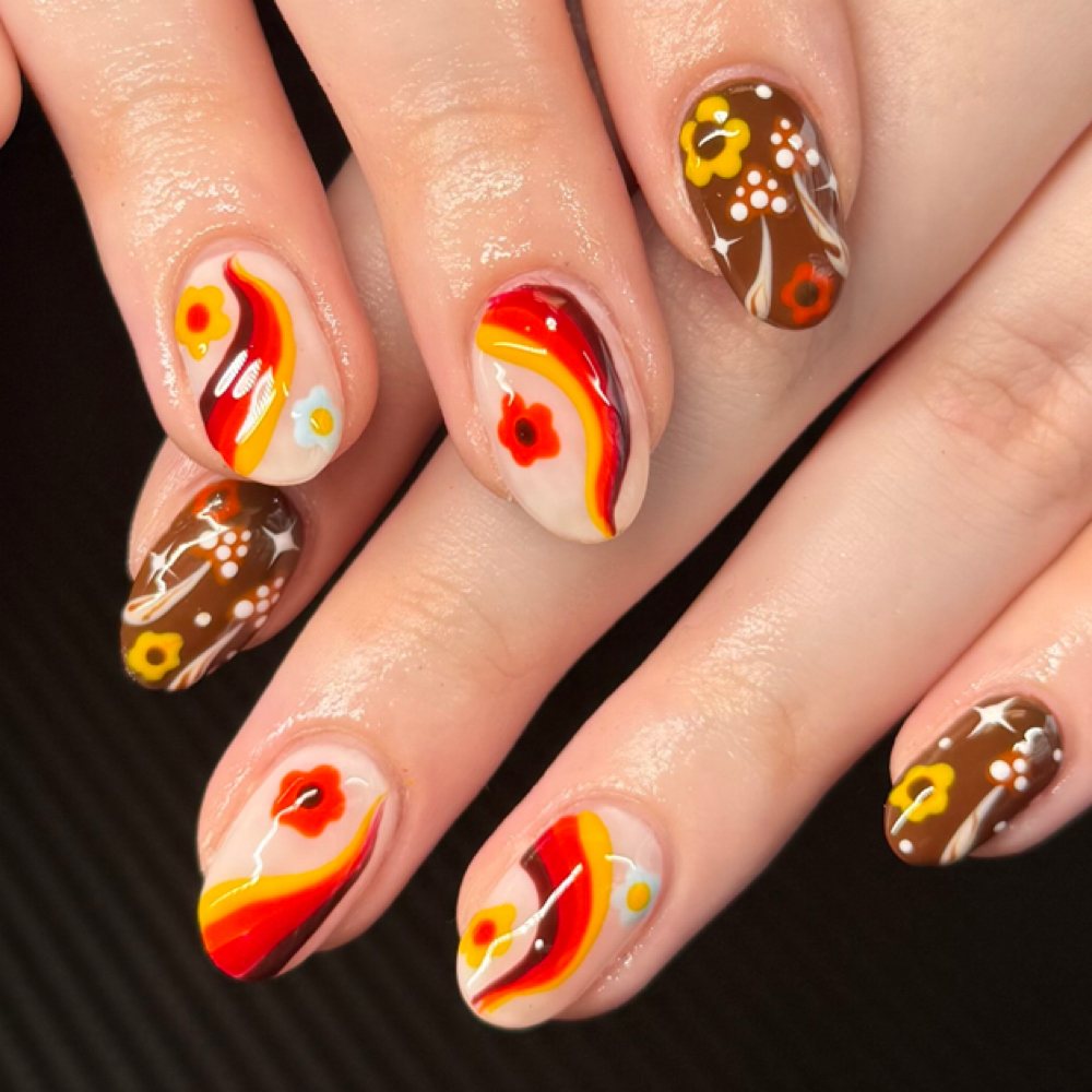 Orange swirl art on a builder gel fill