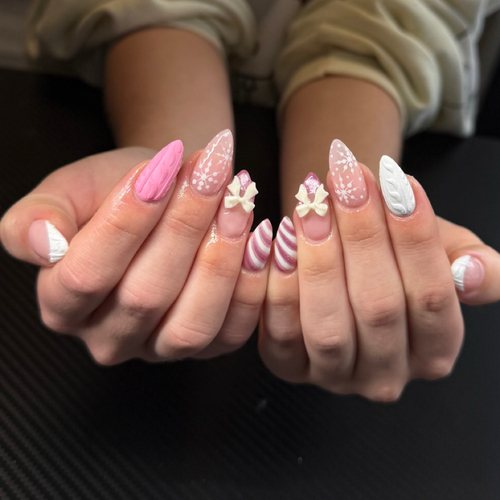Pink nail art with charms