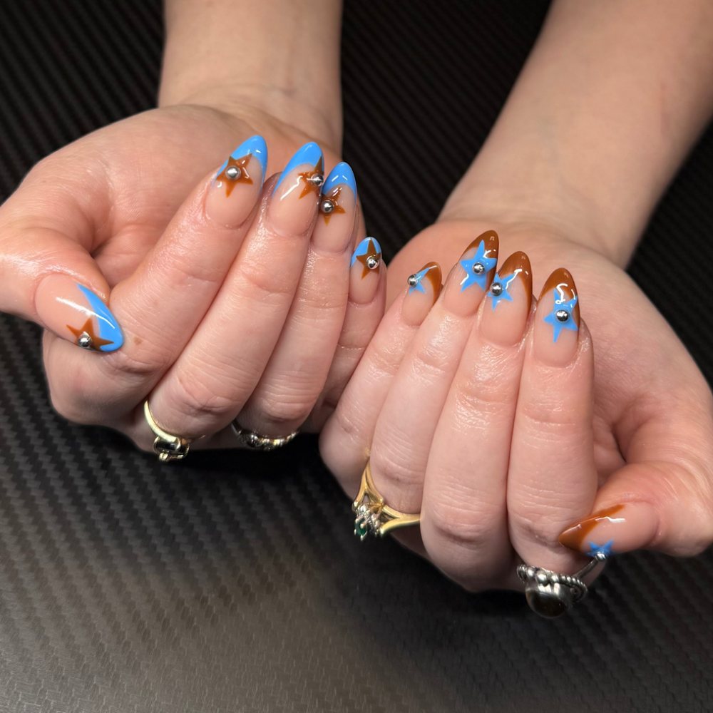 Blue French tips with gold star charms